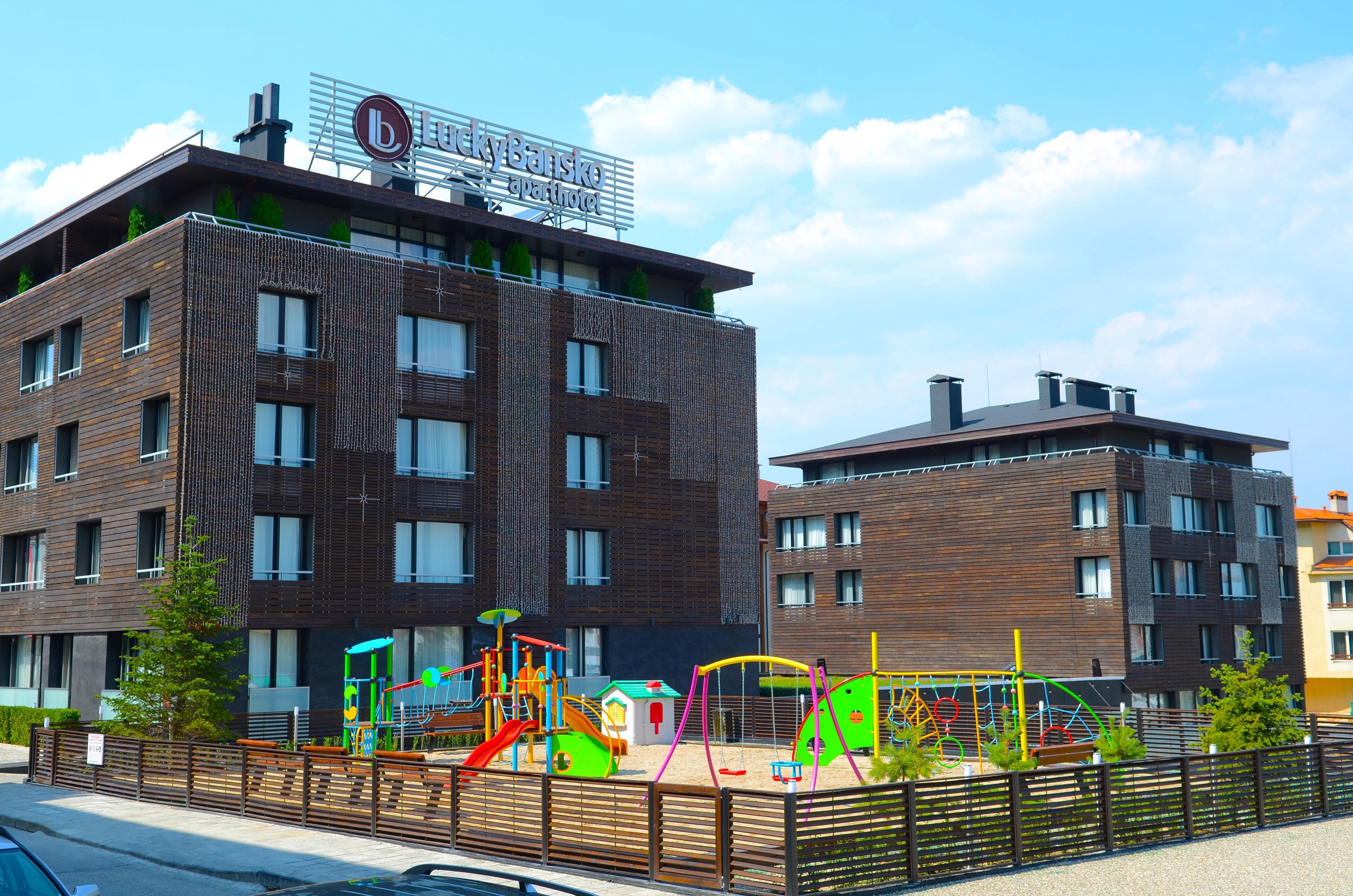 Facade with children playground | Lucky Bansko SPA & Relax